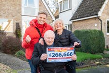 John Tilley, diagnosed with Parkinson's disease in 2014, won £266,666. He is joined by wife Shirley and Postcode Lottery ambassador Jeff Brazier