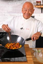 EDITORIAL USE ONLY Ken Hom cooks ’Ken's Pork with Chu Hou Sauce’ from the new ‘Wok From Hom’ recipe series, a collaboration with Lee Kum Kee aiming to offer healthier, more affordable home-cooked alternatives to Chinese takeaways. Issue date: Thursday September 29, 2022. PA Photo. The launch of the series follows research by the brand which reveals almost 6 in 10 British people say they are cutting back on takeaways due to the cost of living. A full list of ingredients and step by step methodology for each recipe can be found on the Lee Kum Kee website from today.