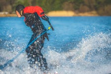 Young British water ski talent, Willow Skipsey, trick skiing through the winter. Image: James Elliott