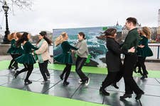 EDITORIAL USE ONLY Passers-by get dancing lessons as Irish dancers perform on Tourism Ireland’s ‘greenest’ dance floor, a pop-up kinetic dance floor on London’s South Bank to celebrate St Patrick’s Day. Picture date: Friday March 17, 2023. The dance floor, which generates energy from the dancers’ movement to light up green and to show landscapes from the island of Ireland, opens early this morning for a limited time as part of the capital’s St Patrick’s Day celebrations.