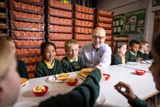 Jonathan Warburton visits Church Road Primary School in Bolton to hand deliver the Warburtons Foundation’s one millionth donated product. Issue date: Friday November 18. PA Photo. The pledge to donate one million products was made earlier this year through the foundation, which aims to support families across the UK through community hubs including schools and food banks. The Warburtons Foundation has donated roughly £260k directly to local charities and community projects across the UK this year.