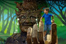 EDITORIAL USE ONLY Arty Slaughter age 5 stand in the hand of ‘Elderma’, one of the new interactive tree giants unveiled today at The Lexicon Shopping Centre in Bracknell, commissioned by Bracknell Forest Council to launch its ‘Green and Active Heroes volunteering scheme’. Picture date: Wednesday August 24, 2022. PA Photo. The scheme, which is part of the Bracknell Forest Festival, has been designed to encourage people within the borough to spend more time outdoors and closer to nature. Photo credit should read: David Parry/PA Wire