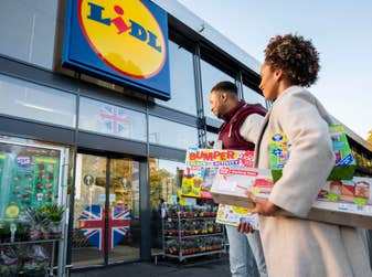 EDITORIAL USE ONLY Indiana and Jermaine preparing to donate toys at a Lidl in Mitcham, London as the supermarket announces the launch of its new nationwide toy donation drive ahead of the festive season. Issue date: Tuesday October 11, 2022. PA Photo. Launching in over 940 stores from November 3, customers will be able to donate new and unopened toys and games to be gifted to children that need support in their local area. The donations will be allocated to local charities participating in Lidl’s ‘Feed it Back’ scheme, coordinated by Neighbourly.