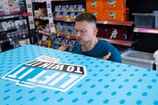 EDITORIAL USE ONLY Former Love Island contestant and fitness entrepreneur Alex Bowen attempts to lift the lid of the ‘worlds heaviest freezer door’, weighing 170kg, as part of the ‘Lift it, to win it’ competition from Myprotein. Issue date: Monday May 15, 2023. PA Photo. The competition, which takes places from Friday May 19 to Sunday May 21 at the Iceland/Food Warehouse Tottenham store in North London, will see the first person to successfully lift the lid win the freezer’s entire contents, a year’s supply of Myprotein meals. Picture credit should read: Rachel Adams/PA Wire.