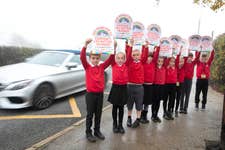 EDITORIAL USE ONLY Nine children from Ravenfield Primary Academy, Rotherham, hold Road Safety Week banners representing the number of pedestrians and cyclists killed every week across Britain in 2021. Picture date: Monday November 14, 2022. PA Photo. The theme of Road Safety Week is Safe Roads for All. The Week is highlighting the vulnerability of people walking and cycling and the need for drivers to follow the Highway Code, particularly slow down and give space to vulnerable road users.