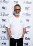 David Baddiel poses for a picture as The National Lottery presents a special performance of 'Three Lions' with Lightning Seeds, David Baddiel, Chelcee Grimes and Lioness legends, at the Electric Ballroom on July 30, 2022 in London, England.
