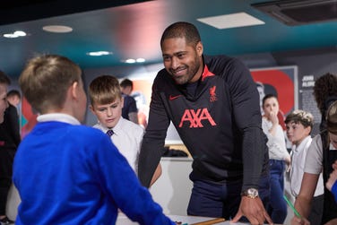 Glen Johnson joining young fans in learning about recycling at an SC Johnson event on sustainability