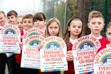 EDITORIAL USE ONLY Nine children from Ravenfield Primary Academy, Rotherham, hold Road Safety Week banners representing the number of pedestrians and cyclists killed every week across Britain in 2021. Picture date: Monday November 14, 2022. PA Photo. The theme of Road Safety Week is Safe Roads for All. The Week is highlighting the vulnerability of people walking and cycling and the need for drivers to follow the Highway Code, particularly slow down and give space to vulnerable road users.